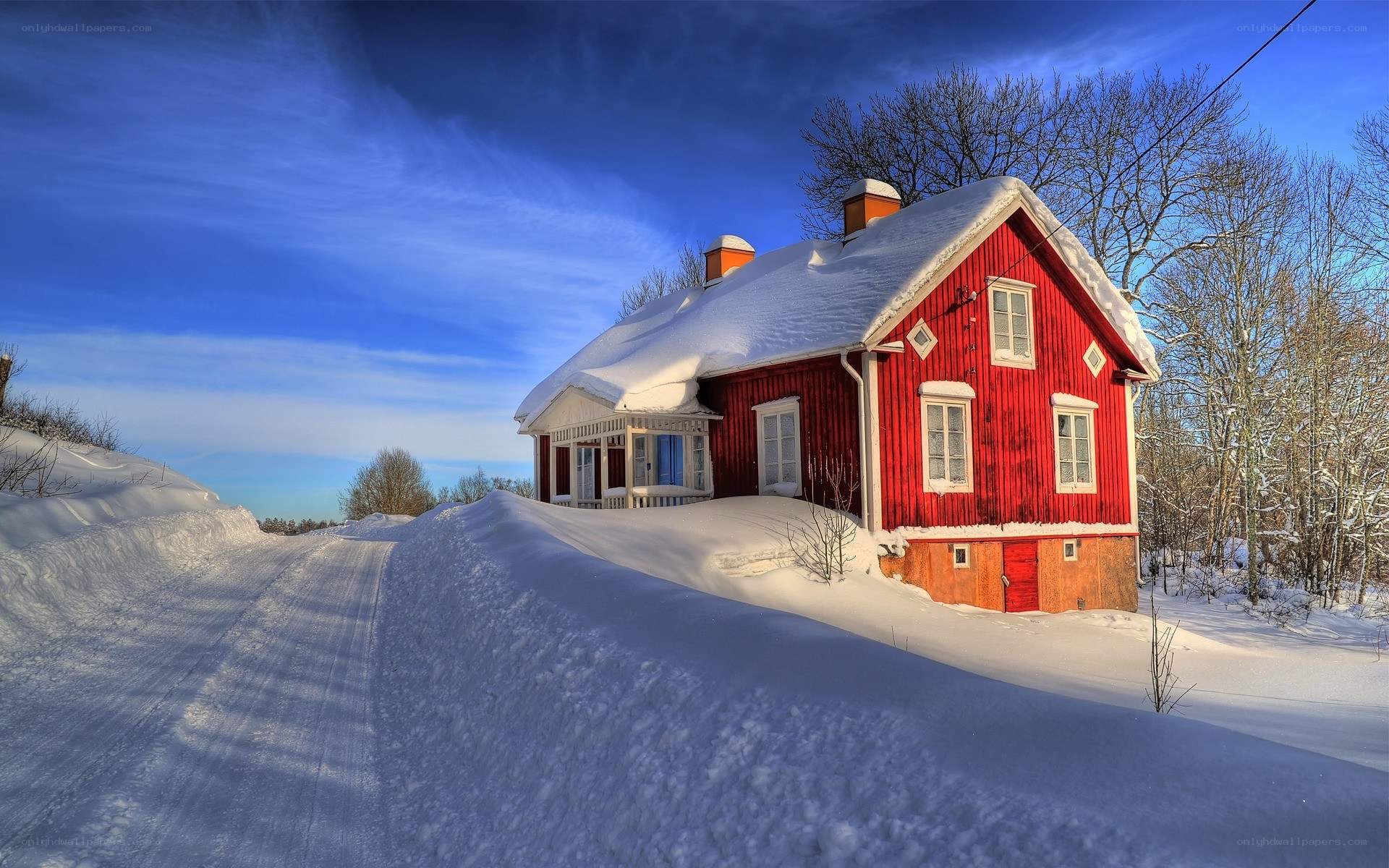 Red house in snowy landscape