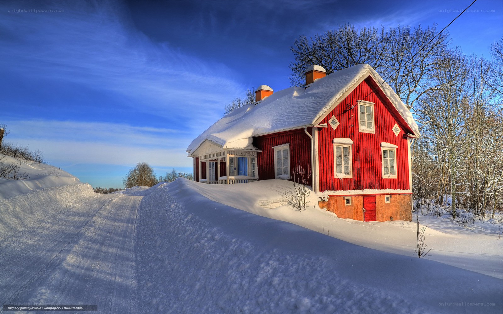 Red house in snowy landscape