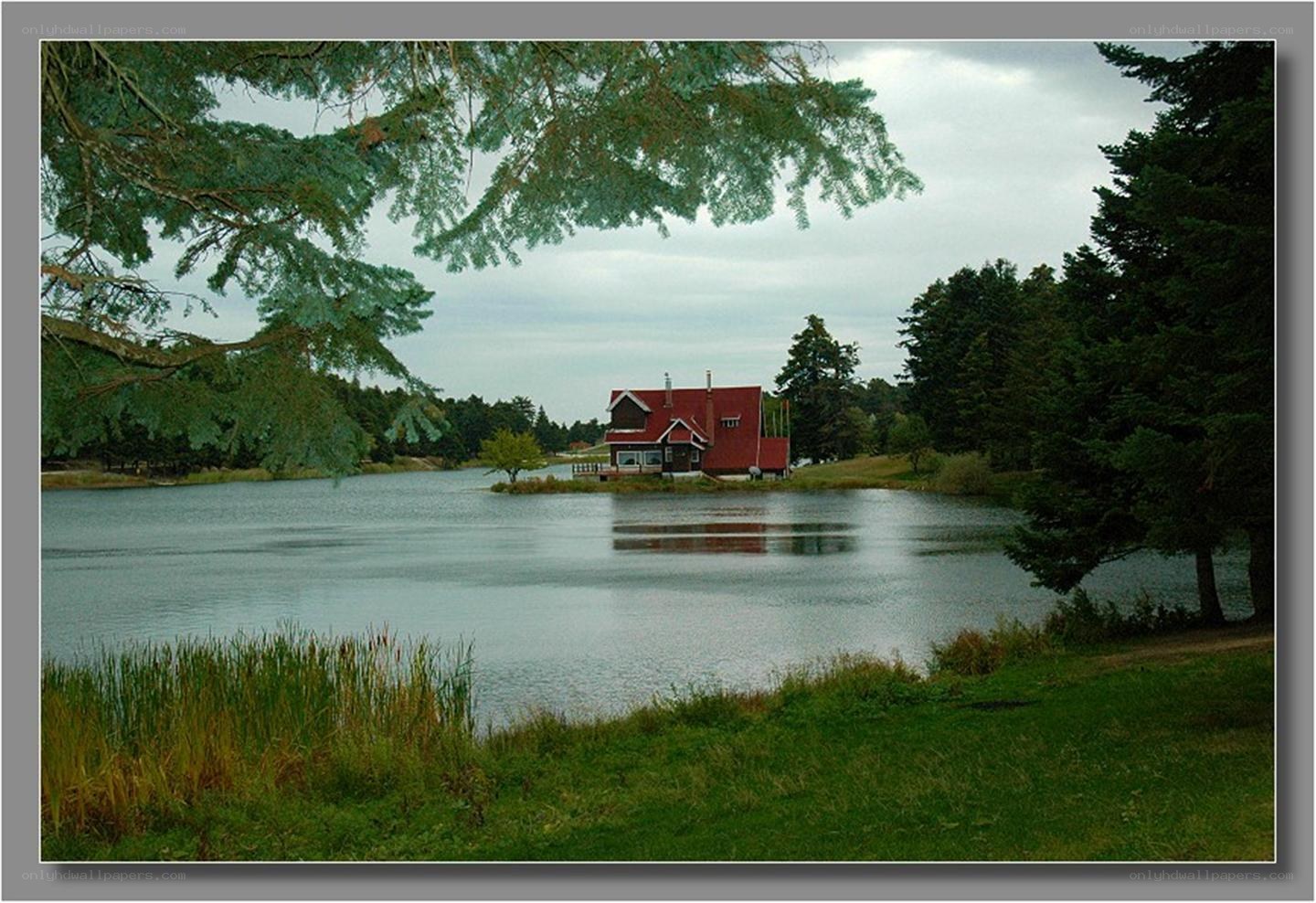 Red house on a lake