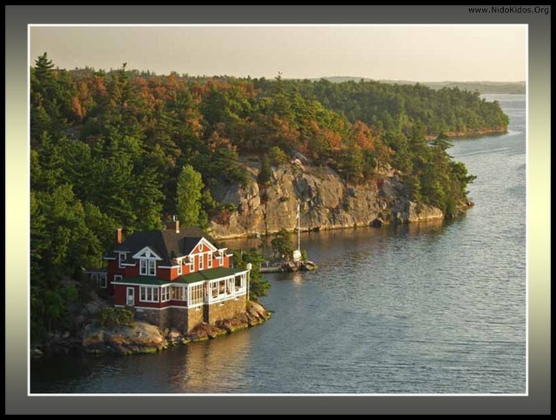 Red house on lakeside cliff