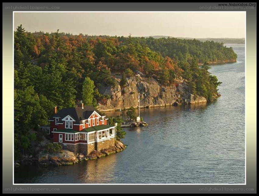 Red house on lakeside cliff