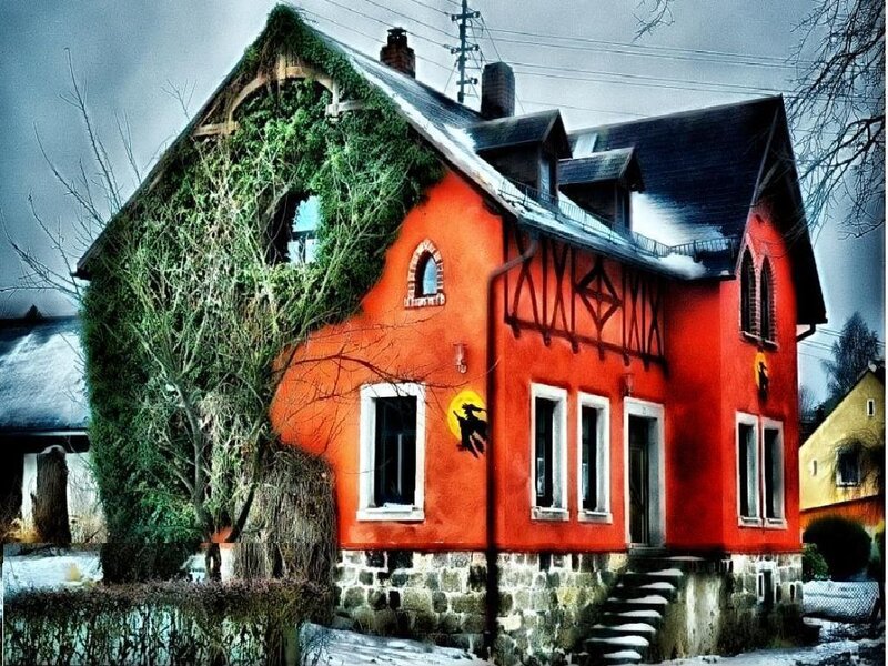 Red house with ivy and witch art