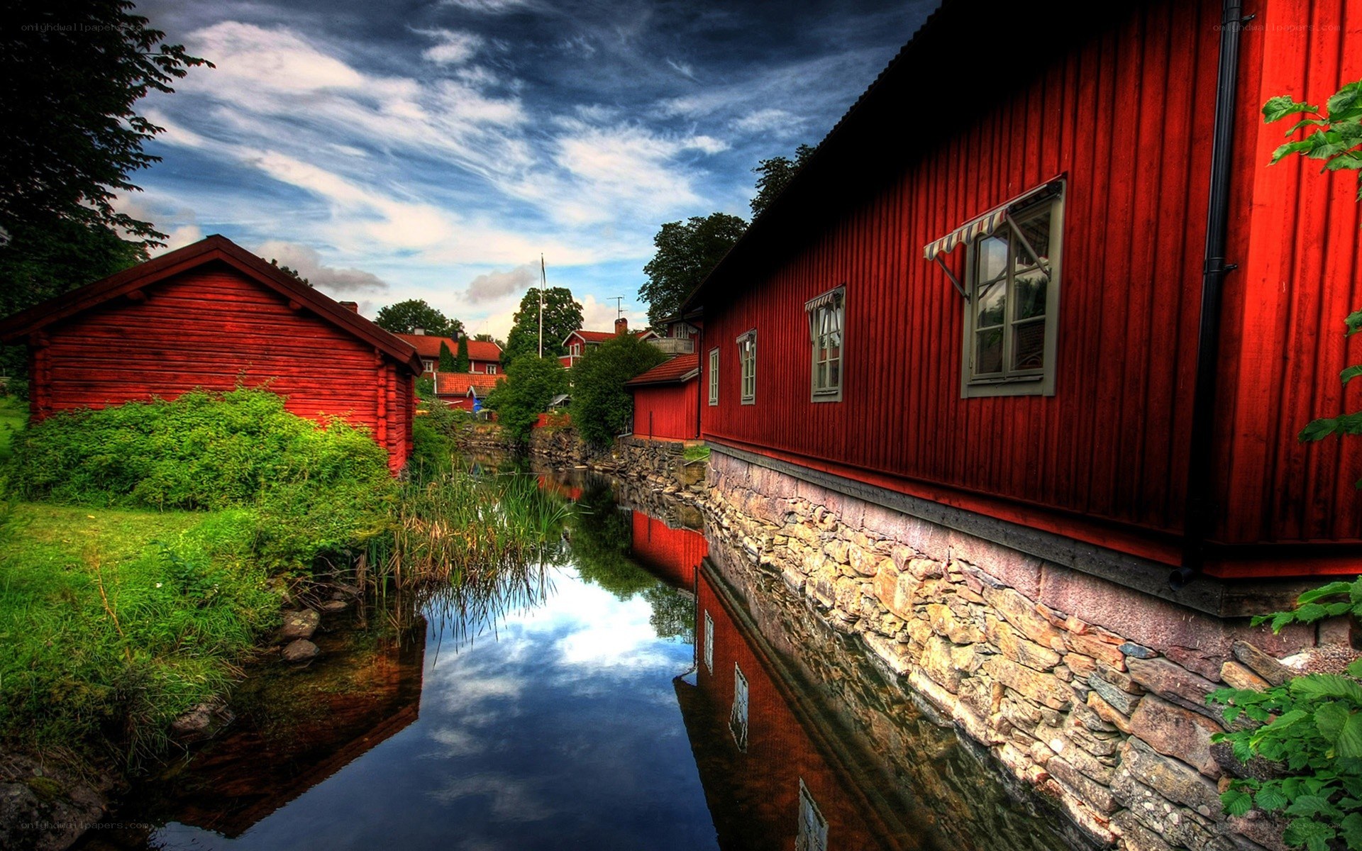 Red houses by a canal