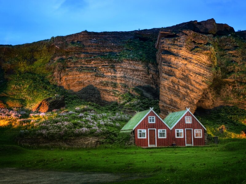 Red Houses by Cliffs — Green, Serene, Sunset, Photograph