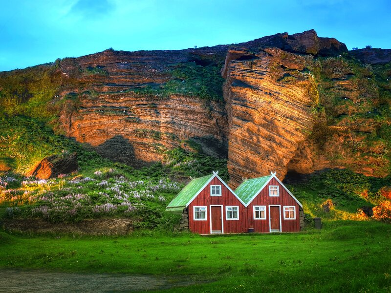 Red Houses by Cliffs — Green, Serene, Sunset