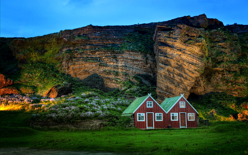 Red Houses by Cliffs