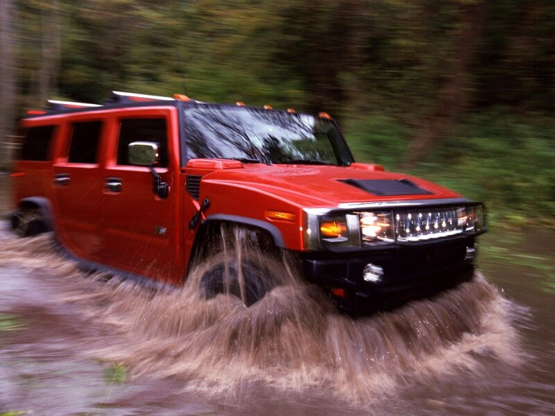 Red Hummer Driving Through Water