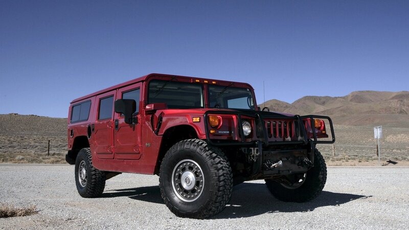 Red Hummer in desert landscape