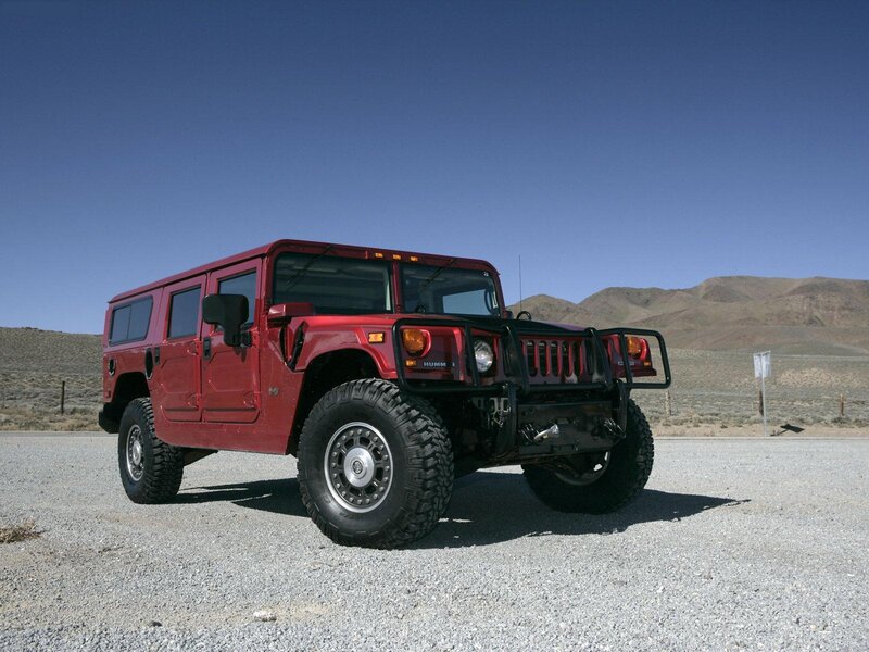 Red Hummer in desert landscape
