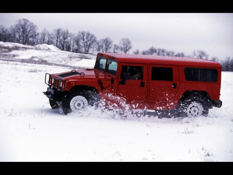 Red Hummer in snowy field