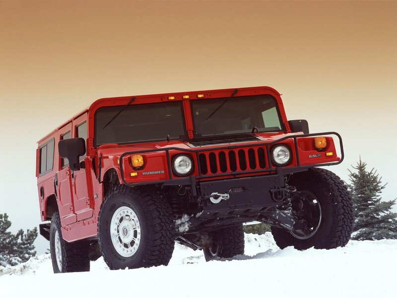 Red Hummer in snowy landscape