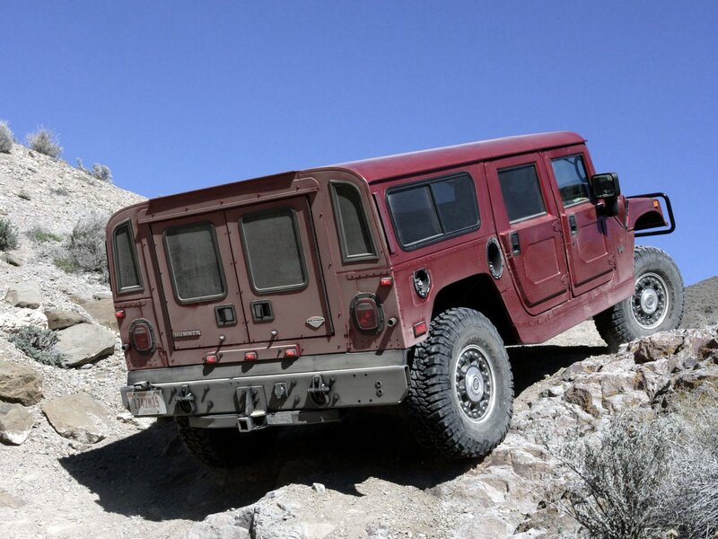Red Hummer on rocky terrain