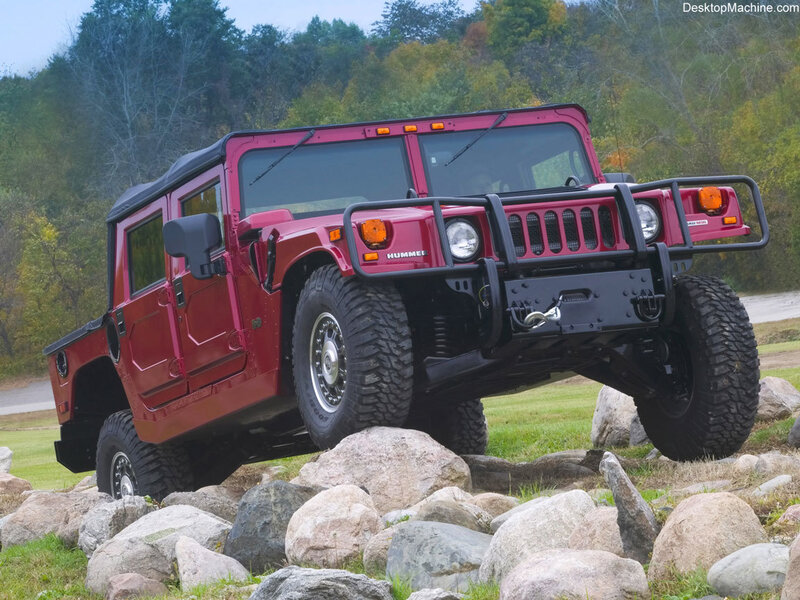 Red Hummer on rocky terrain