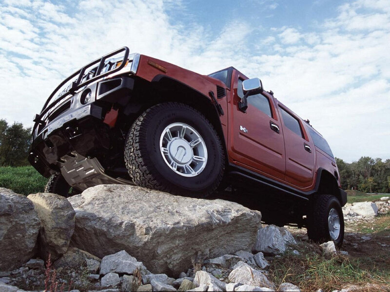 Red Hummer on rocky terrain