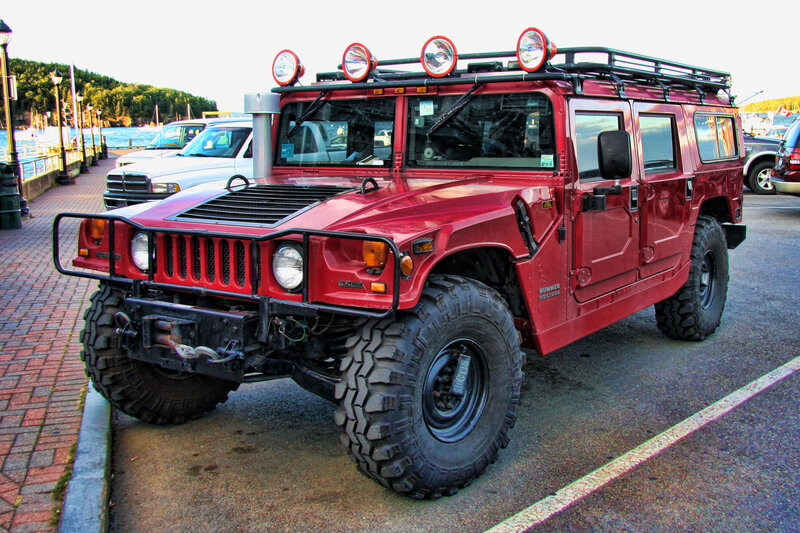 Red Hummer parked by the water