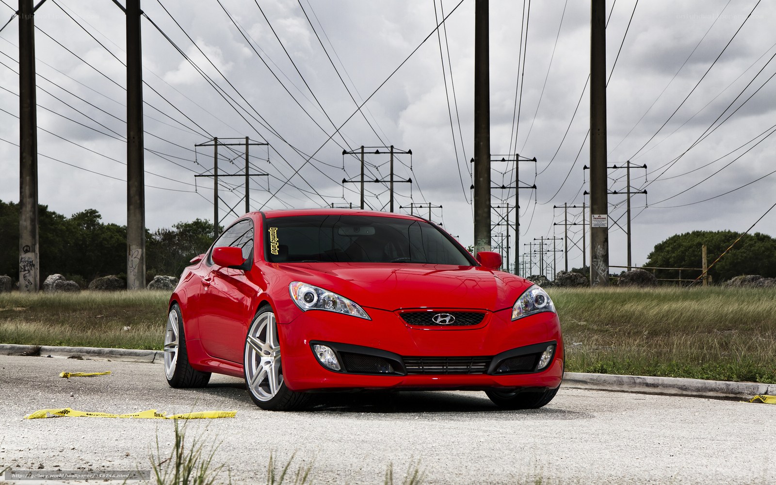 Red Hyundai Coupe on Gravel