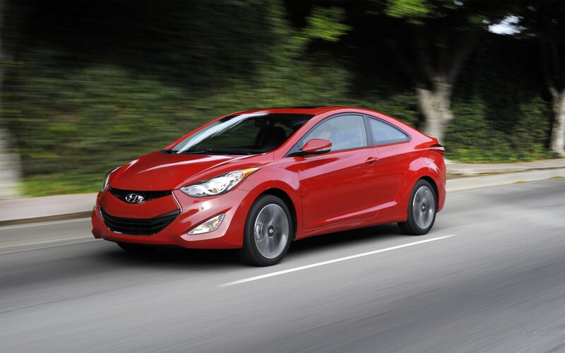 Red Hyundai Elantra Coupe in motion