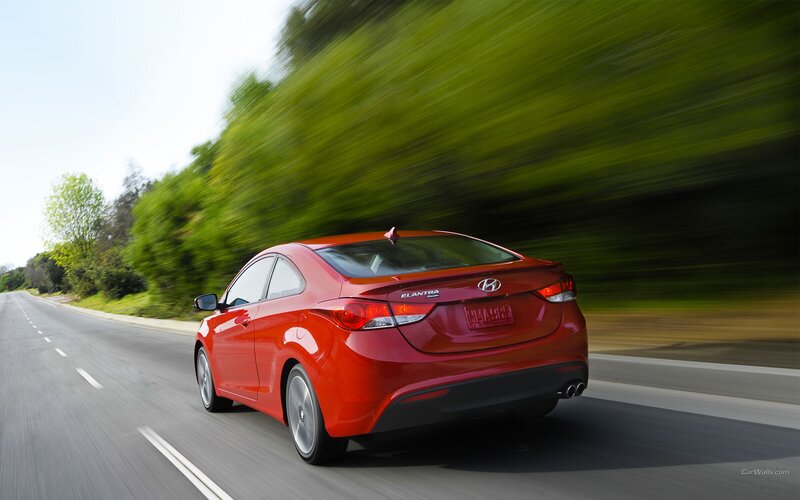 Red Hyundai Elantra in motion