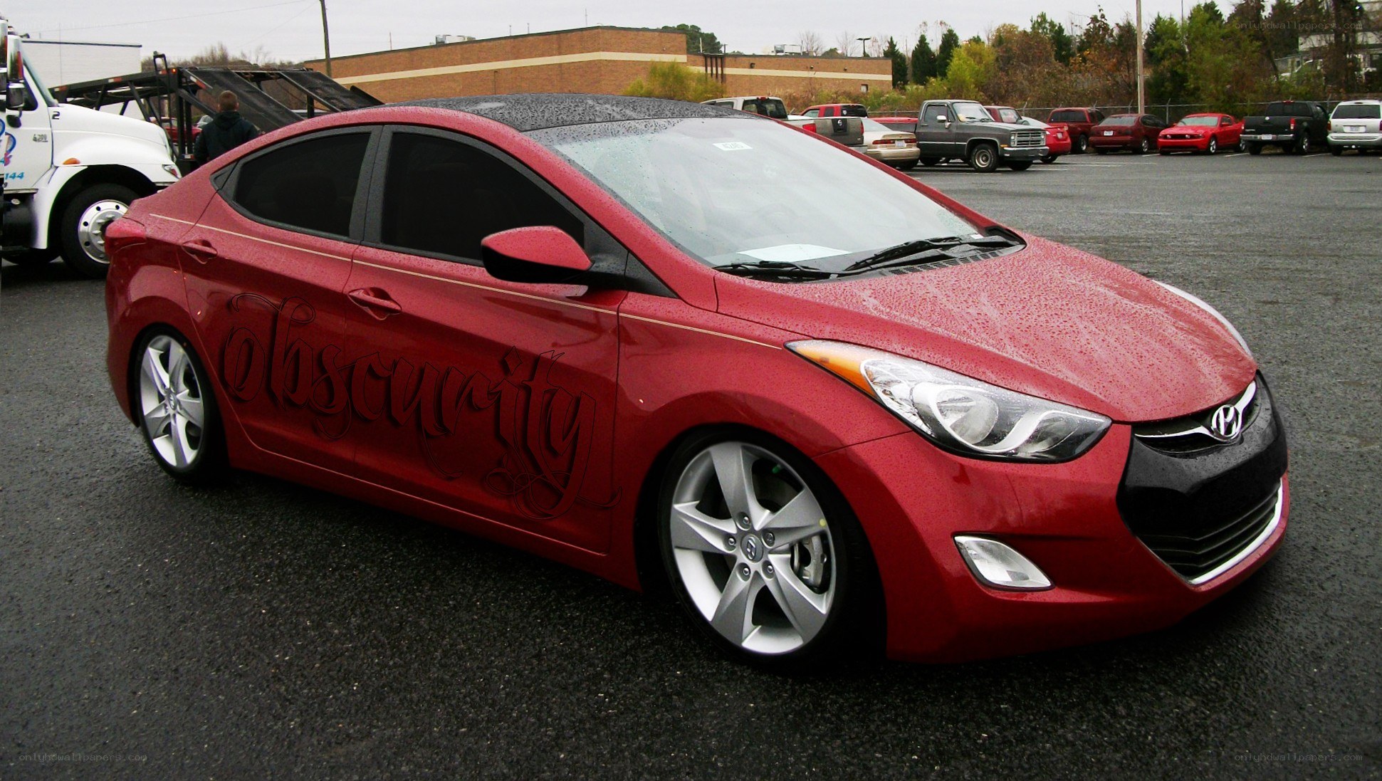 Red Hyundai Elantra with custom graphics