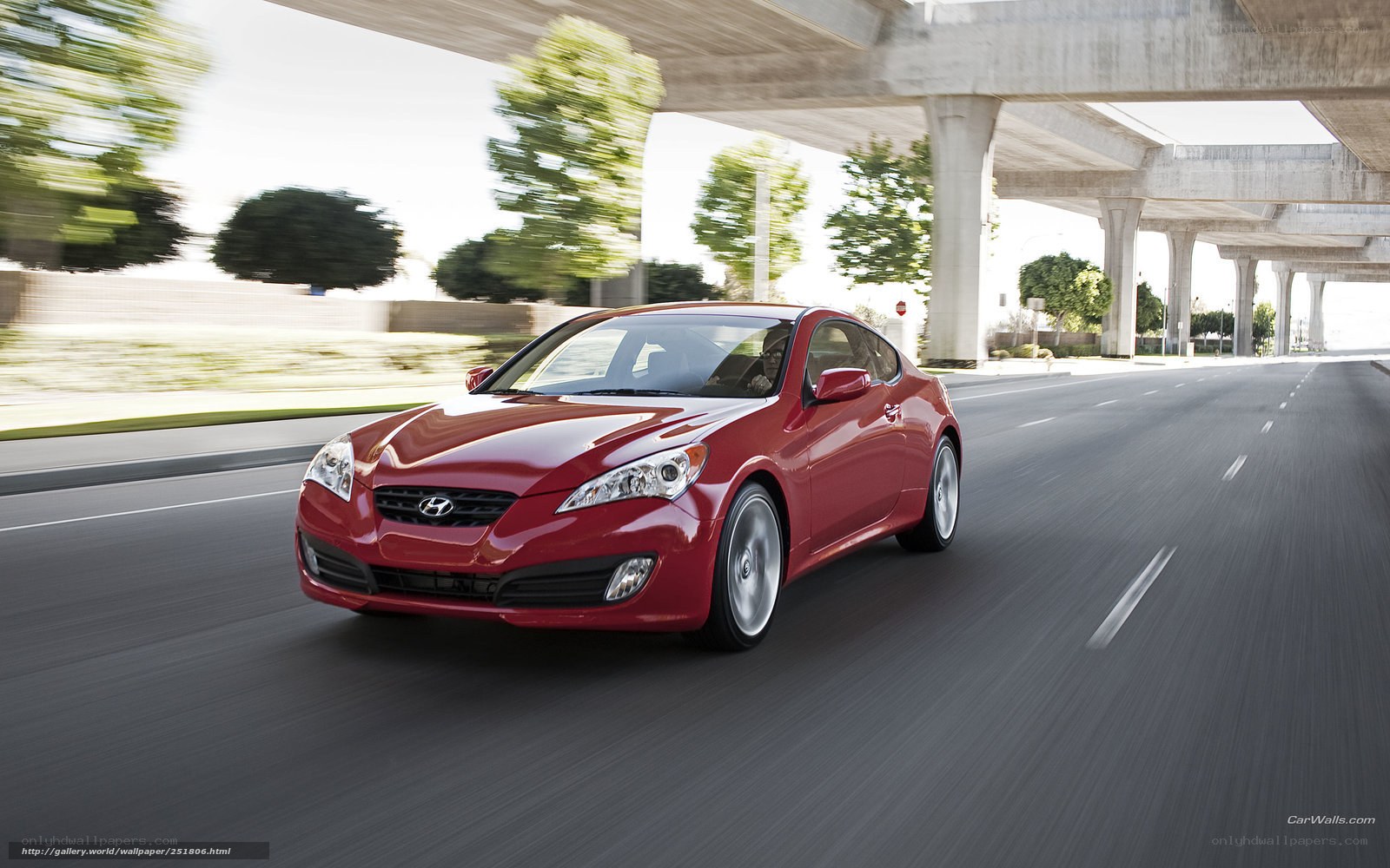 Red Hyundai Genesis Coupe in motion