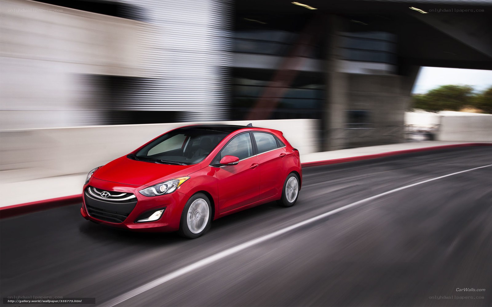 Red Hyundai i30 in motion