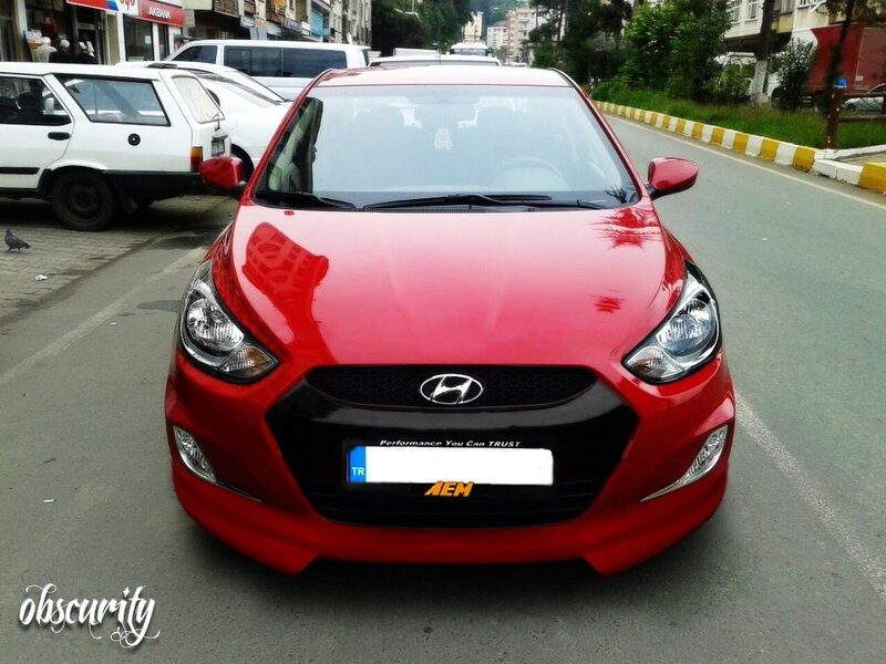 red hyundai on city street
