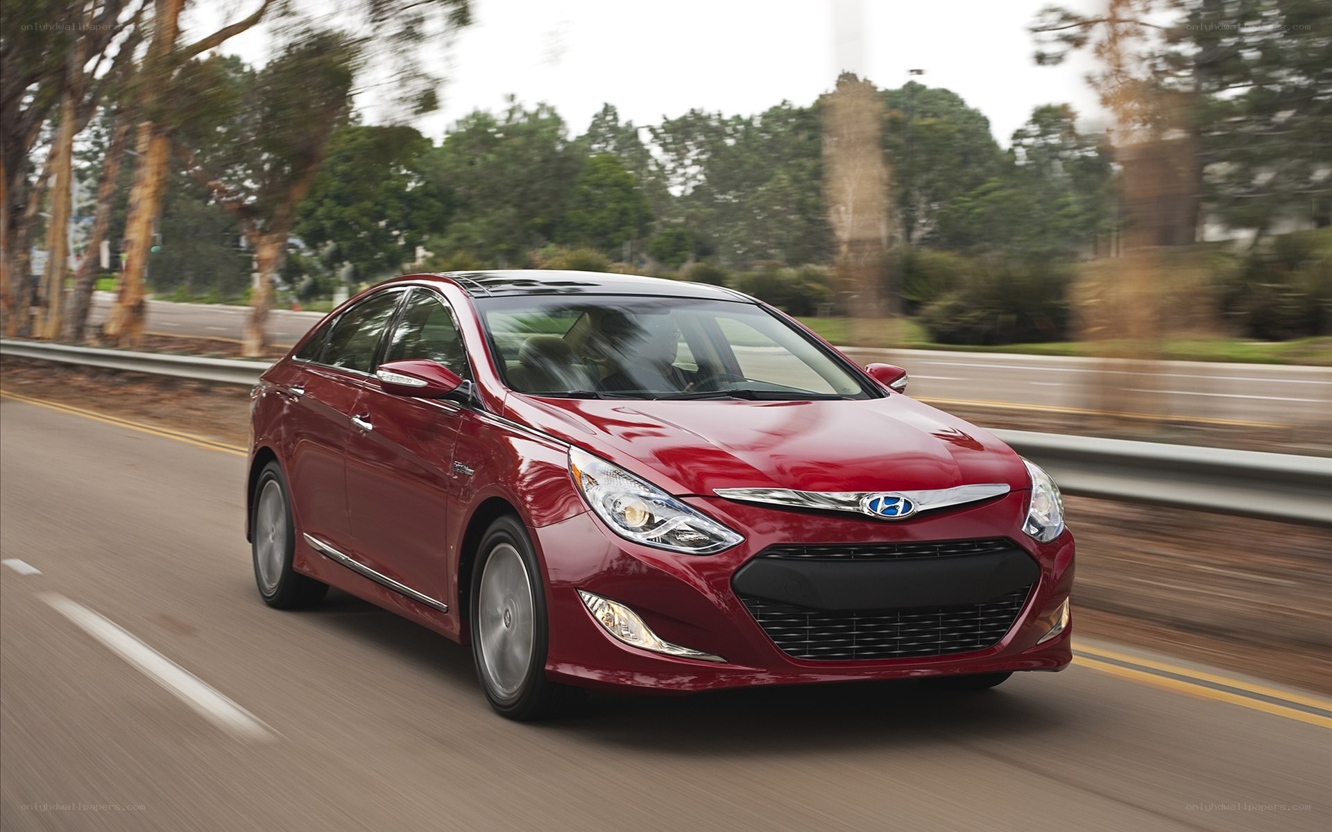 red hyundai sonata in motion
