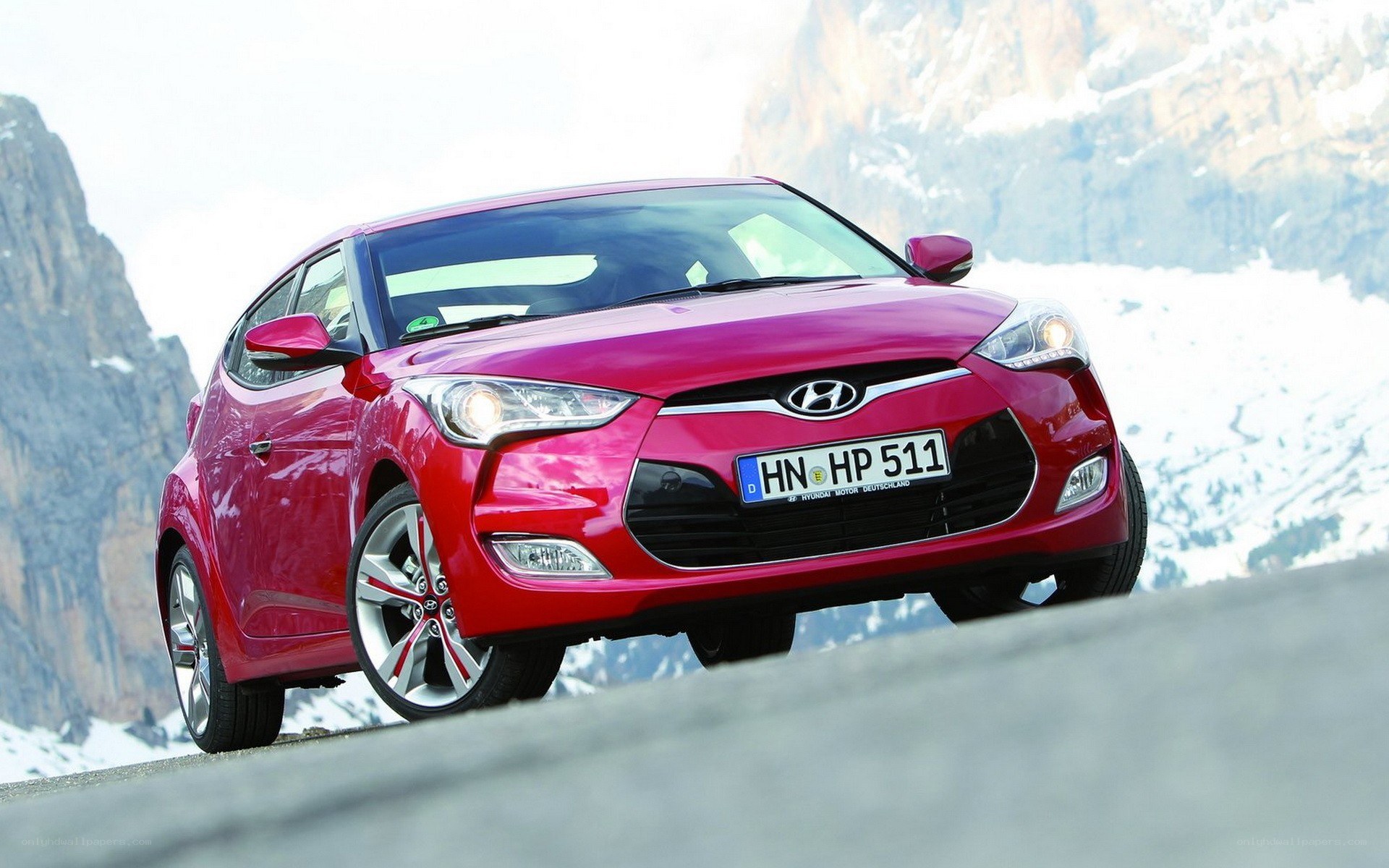 Red Hyundai Veloster on mountain road
