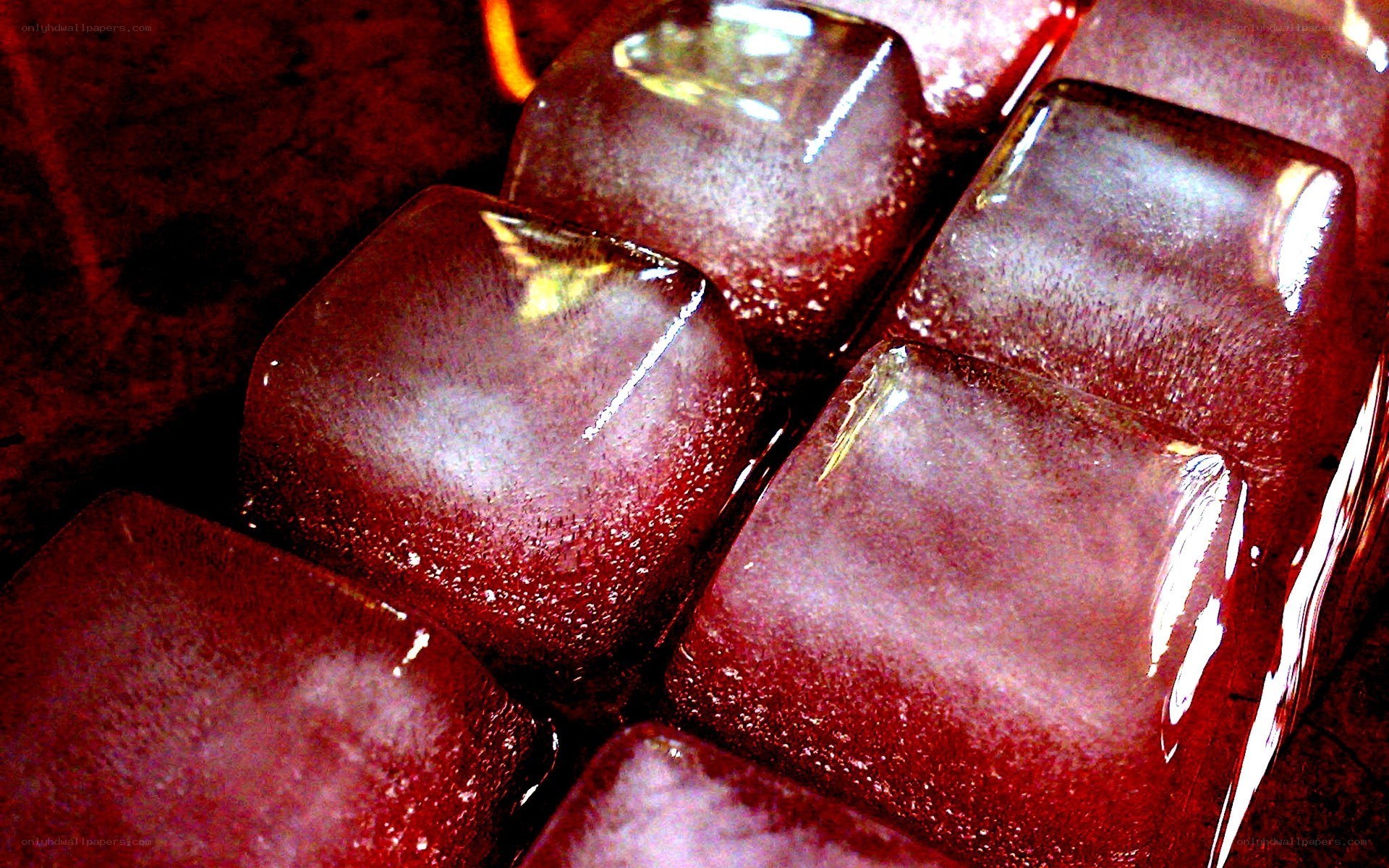 red ice cubes in a drink