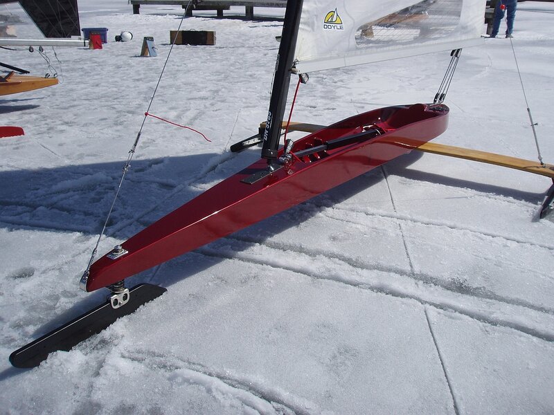 Red ice sailboat on frozen lake