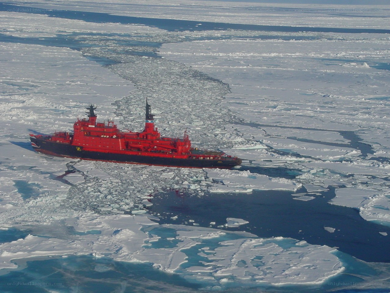 Red icebreaker in Arctic sea