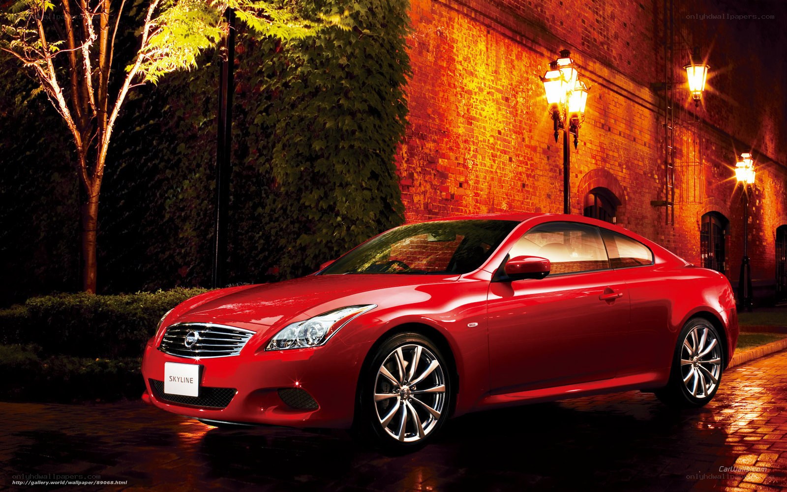 Red Infiniti Skyline at night