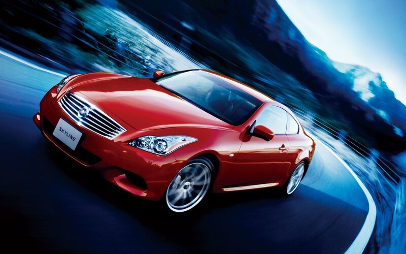 Red Infiniti Skyline in motion