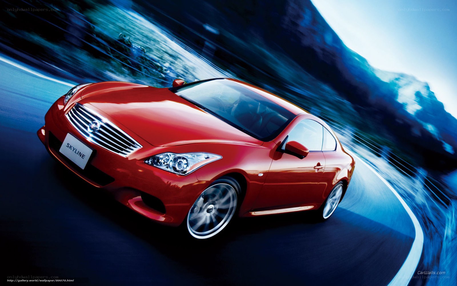 Red Infiniti Skyline in motion