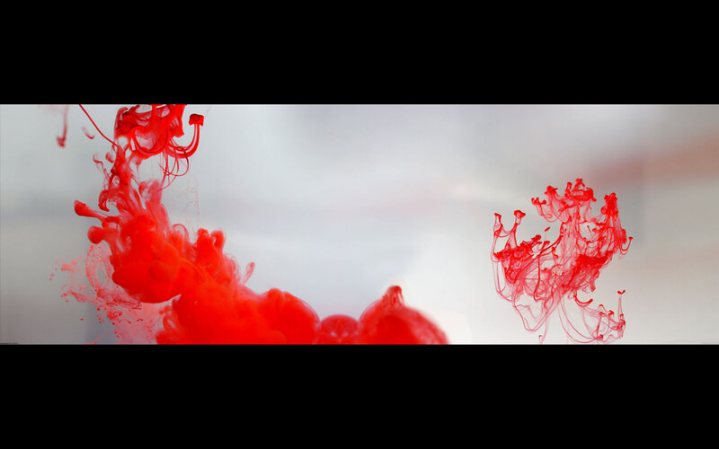 Red ink dispersing in water