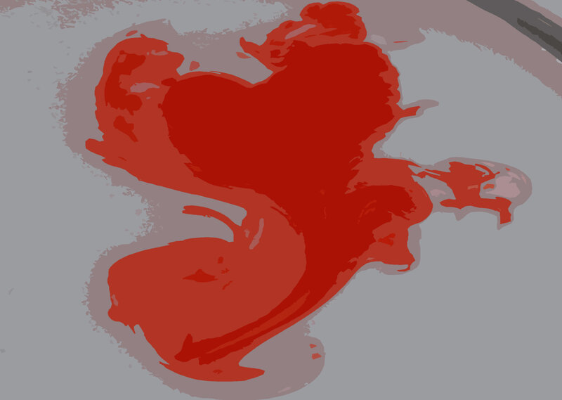 red ink spill on gray surface