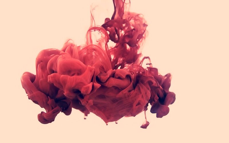 red ink swirling in water