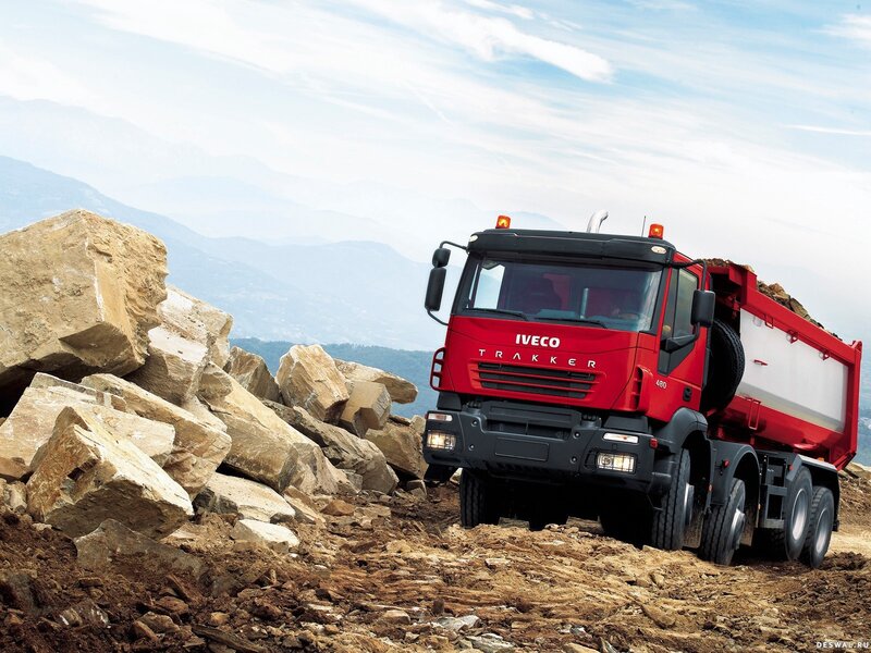 Red Iveco truck on rocky terrain