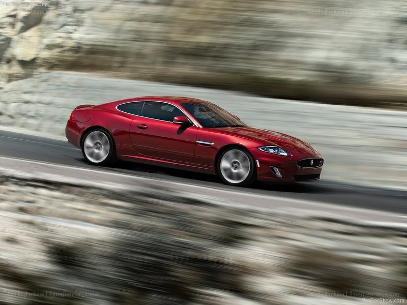Red Jaguar coupe in motion