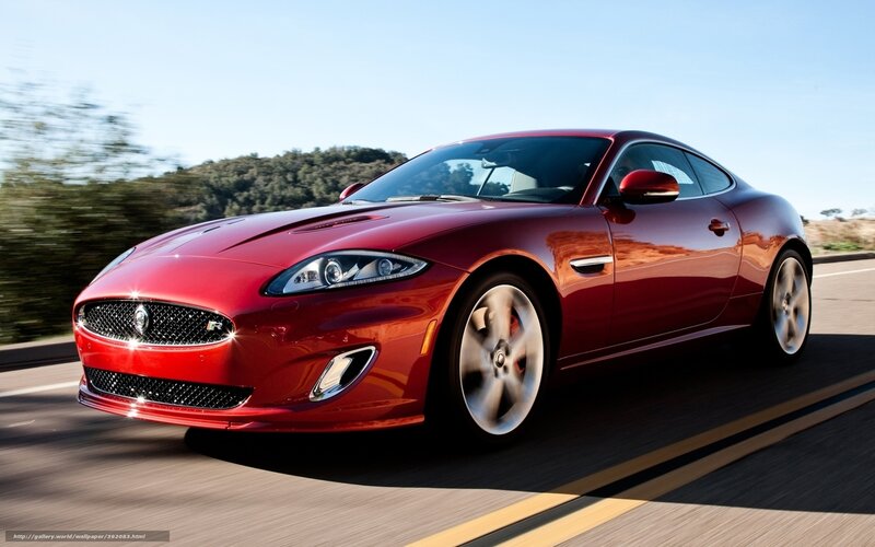 Red Jaguar Coupe in Motion