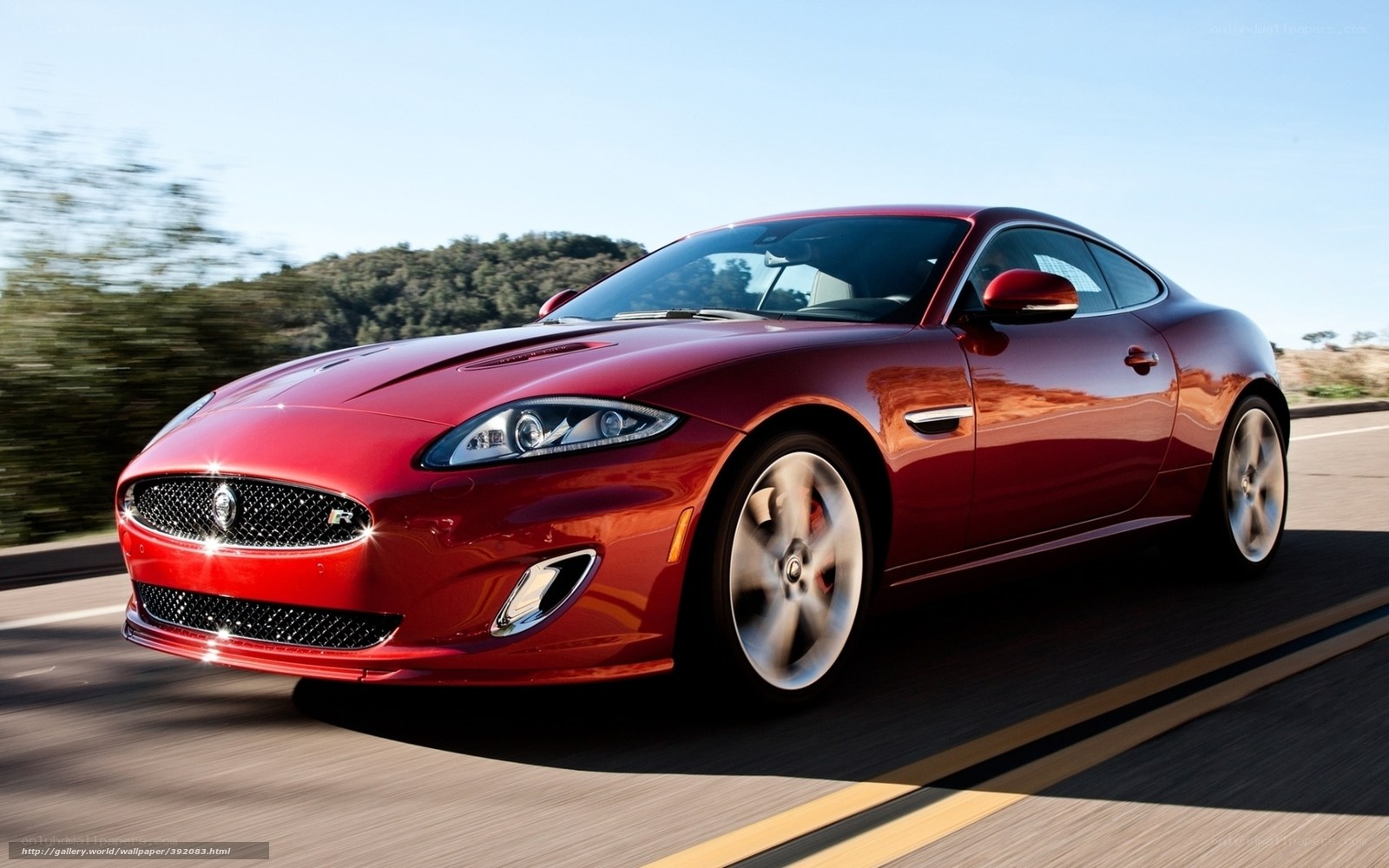 Red Jaguar Coupe in Motion