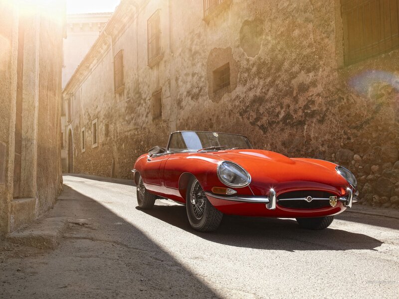 Red Jaguar E-Type on a sunlit street