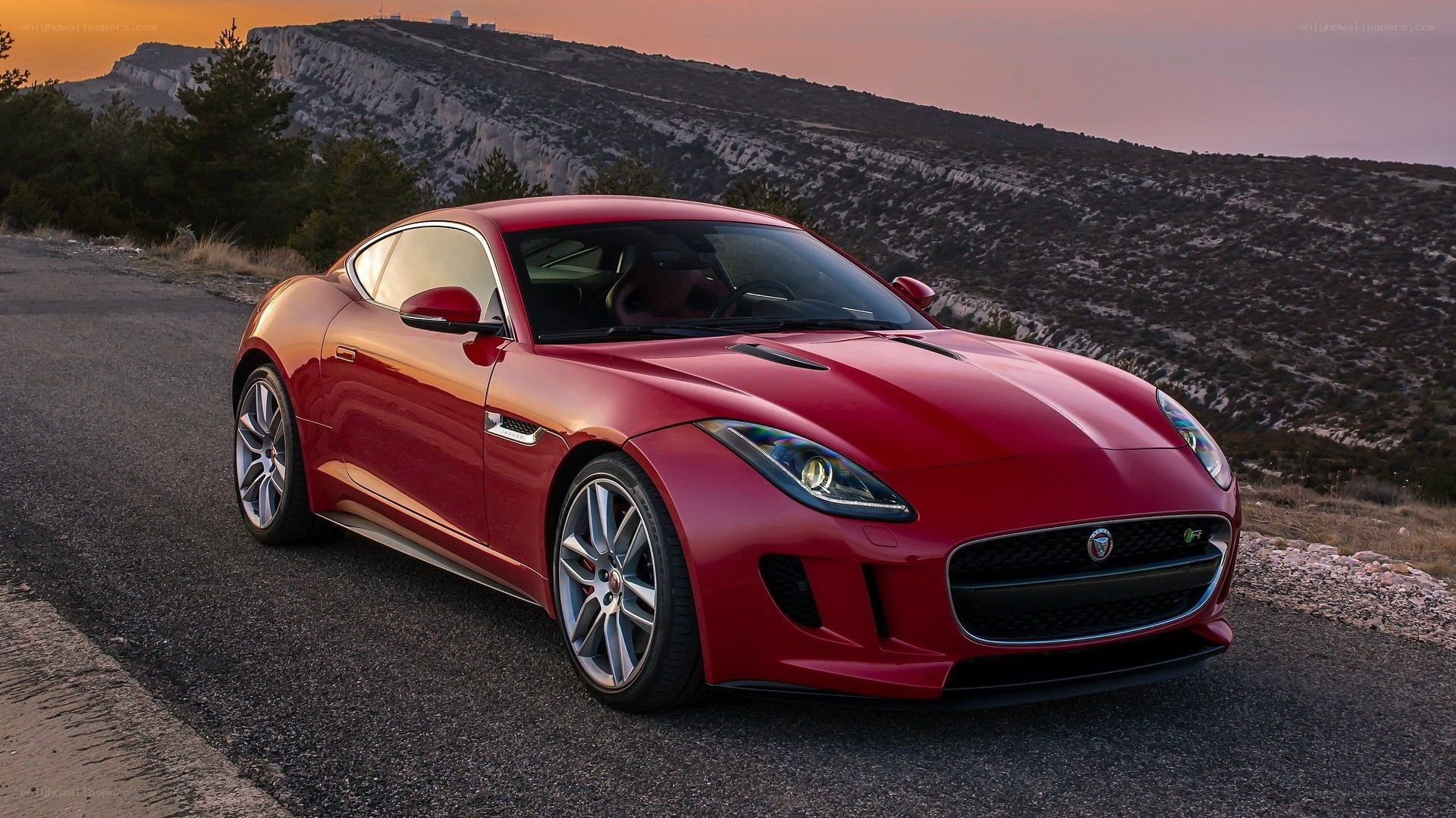 Red Jaguar F-Type on mountain road