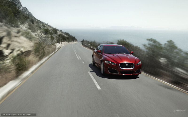Red Jaguar on coastal road