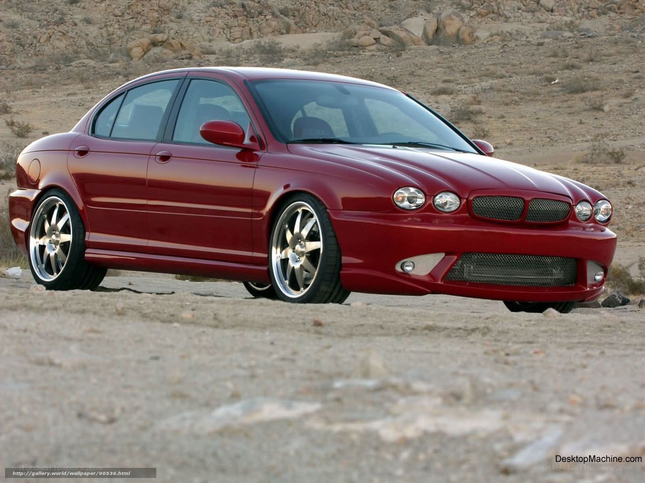 Red Jaguar Sedan in Desert