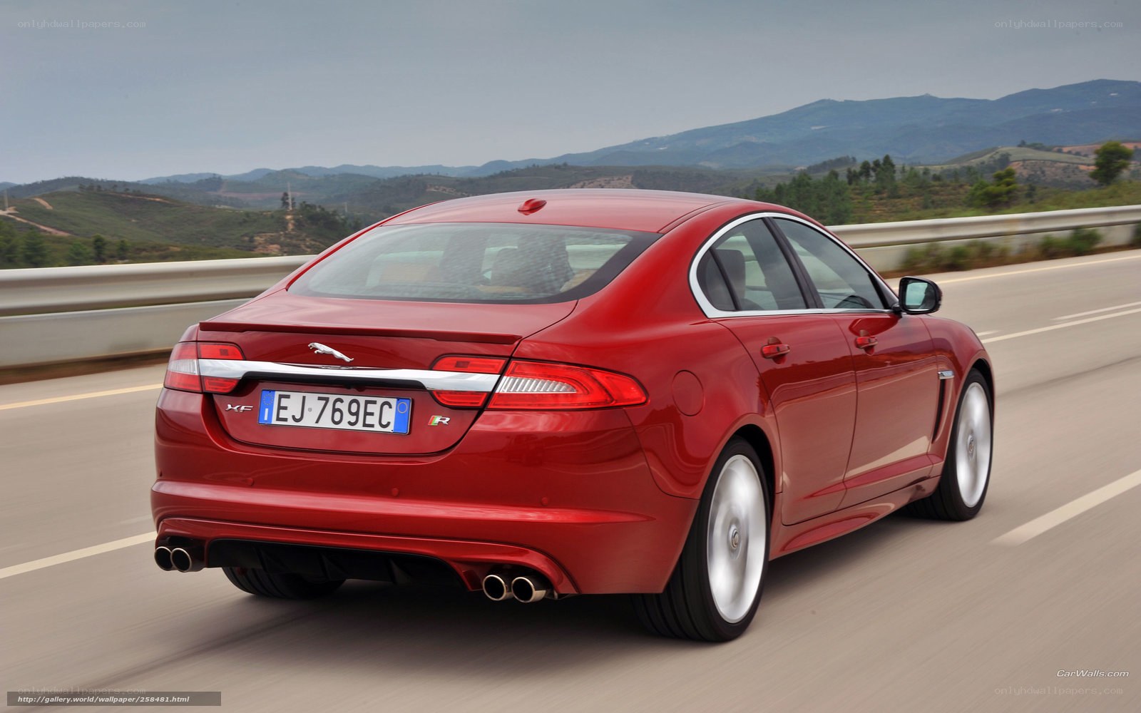 Red Jaguar XF in motion
