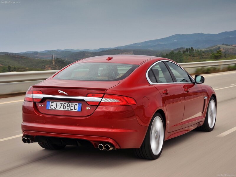 Red Jaguar XF R in motion