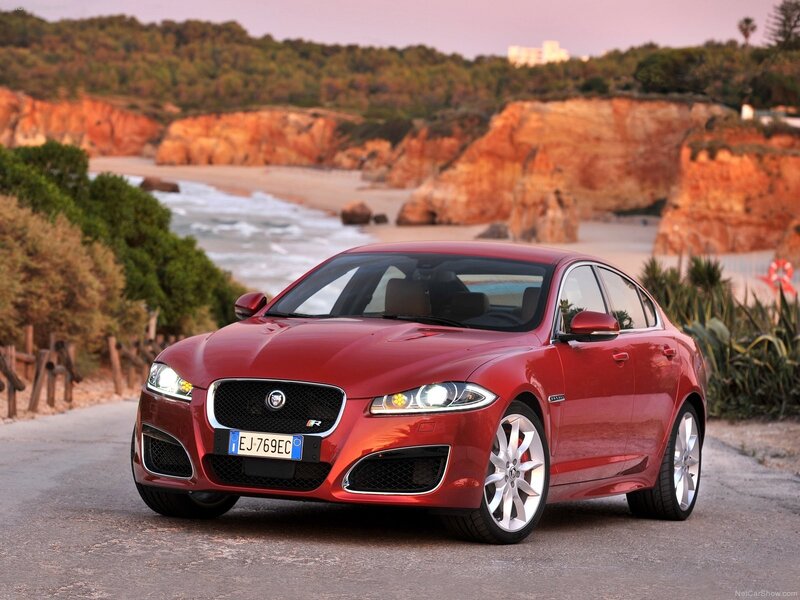 Red Jaguar XFR on coastal road
