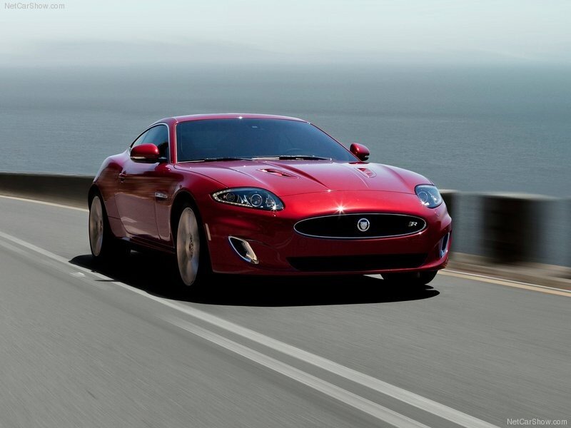 Red Jaguar XKR on coastal road