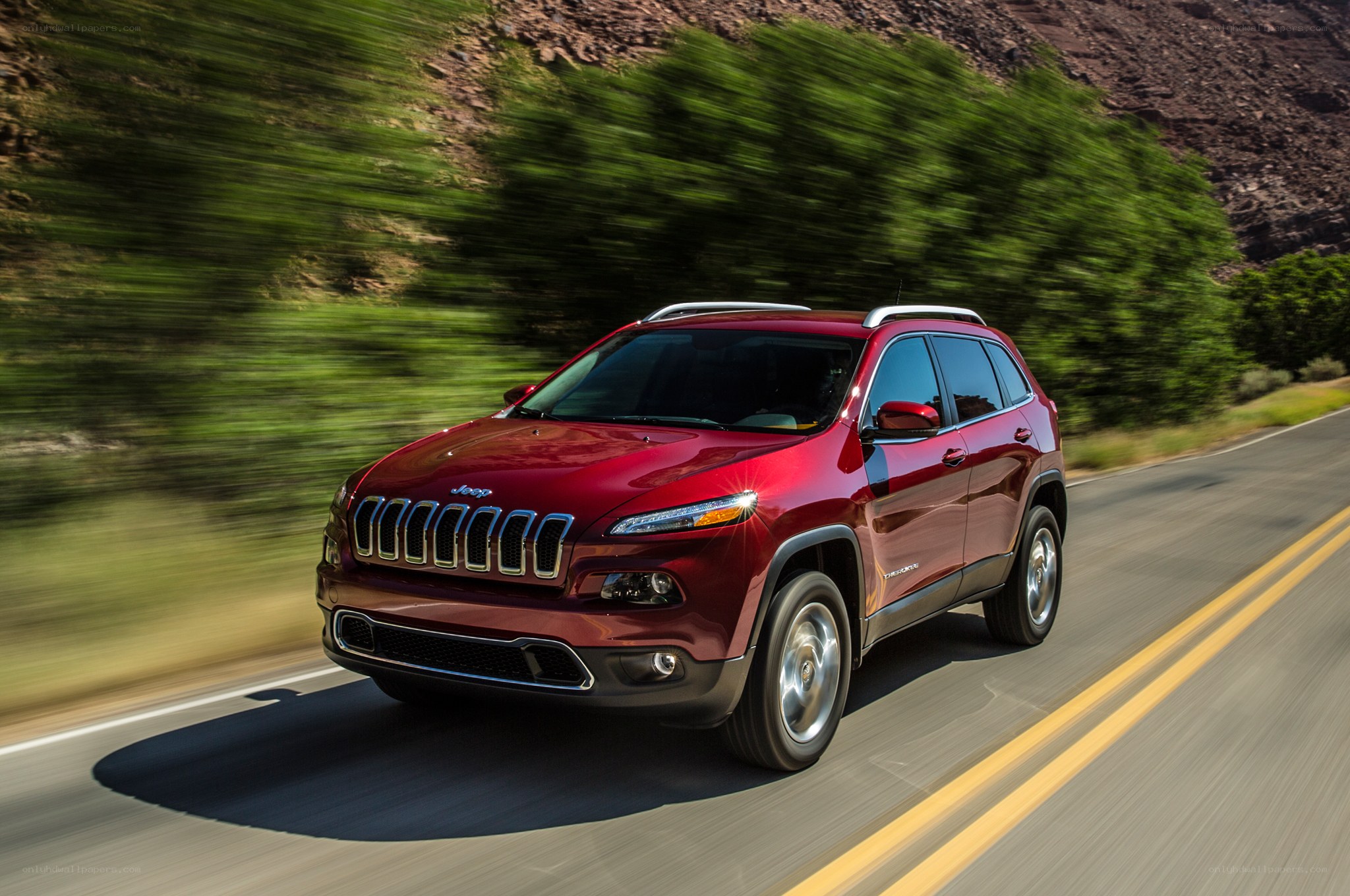 Red Jeep Cherokee on a road
